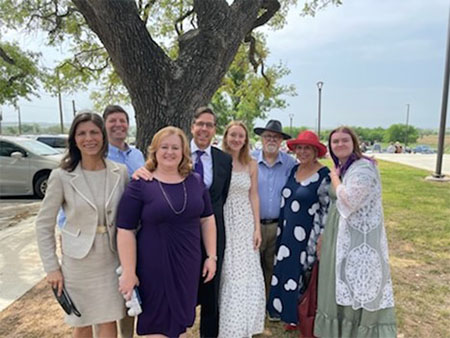 Image of the Cohen family posing in front of an oak tree on Easter Sunday.