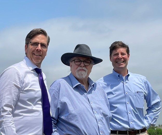 Image of the Cohen family men posing in front of an oak tree on Easter Sunday.