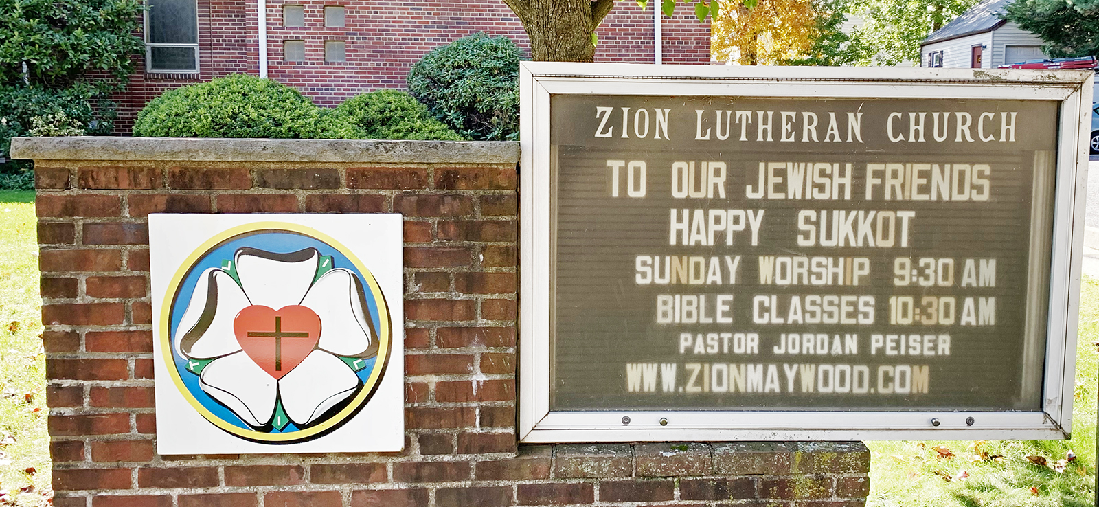 The church announcements board outside Zion Lutheran Church, Mayfield New Jersey, wishing the community a happy Sukkot.